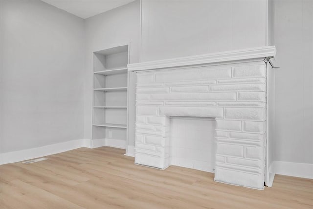 5437 Rosetta St, Garfield, PA 15206 - detailed view of wood finished floors, baseboards, and built in features