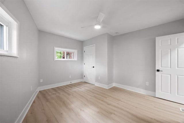 5437 Rosetta St, Garfield, PA 15206 - unfurnished bedroom featuring light wood-type flooring, baseboards, and a ceiling fan