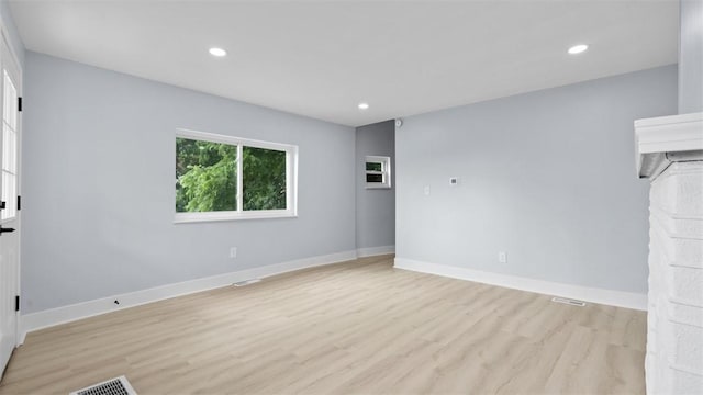 5437 Rosetta St, Garfield, PA 15206 - unfurnished living room featuring light wood-style floors and recessed lighting