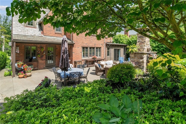 254 Orchard Dr, Mt Lebanon, PA 15228 - rear view of house featuring an outdoor living space, a patio, brick siding, and a high end roof