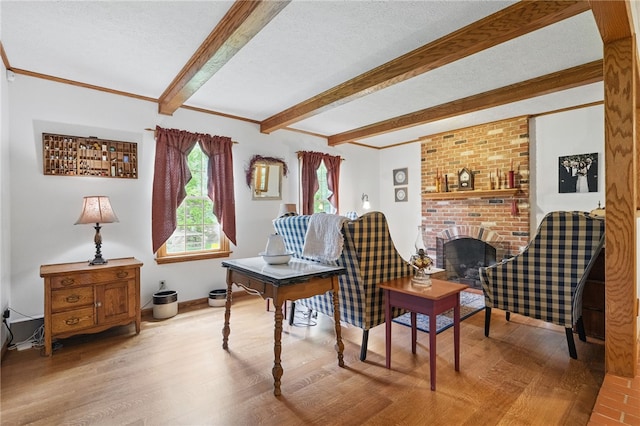 150 Greenfield Rd, Neshannock Twp, PA 16105 - living area featuring wood finished floors, beamed ceiling, a fireplace, a textured ceiling, and crown molding