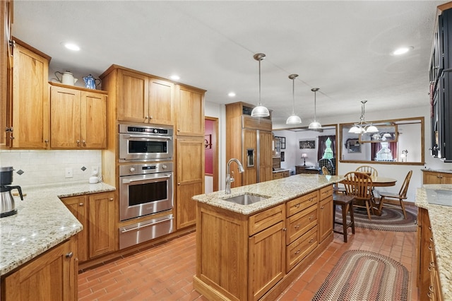 150 Greenfield Rd, Neshannock Twp, PA 16105 - kitchen with a sink, a warming drawer, stainless steel double oven, a center island with sink, and decorative backsplash