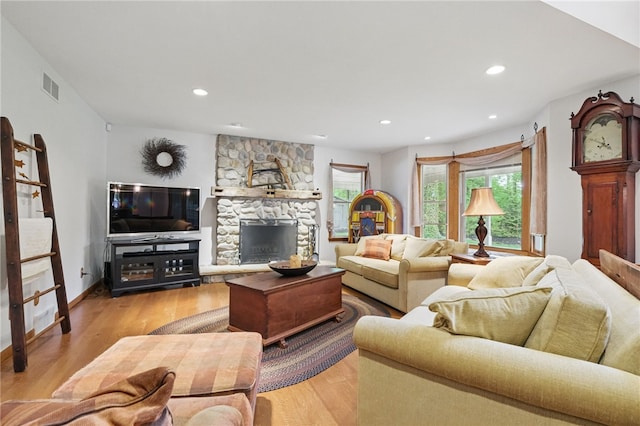 150 Greenfield Rd, Neshannock Twp, PA 16105 - living area with light wood-style flooring, recessed lighting, a stone fireplace, and baseboards