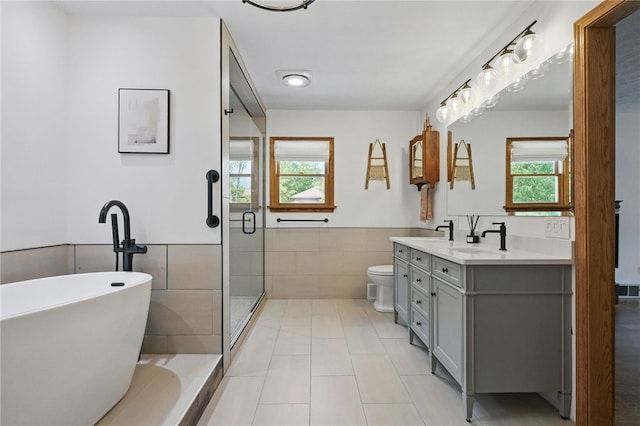 150 Greenfield Rd, Neshannock Twp, PA 16105 - full bath with tile walls, double vanity, a freestanding bath, a stall shower, and tile patterned floors