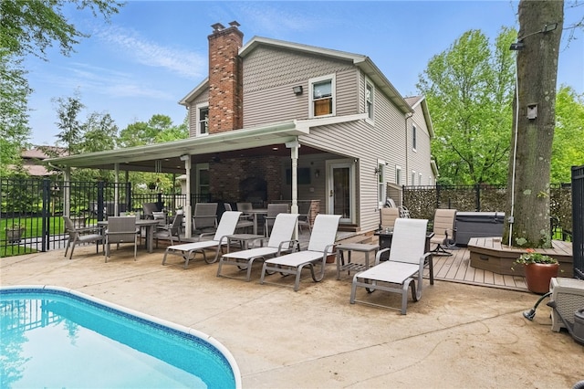 150 Greenfield Rd, Neshannock Twp, PA 16105 - rear view of house with a chimney, a hot tub, and a patio area