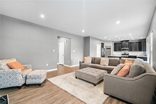 3017 Pelican Dr, Middlesex Twp, PA 16059 - living area featuring light wood-style floors, baseboards, and recessed lighting