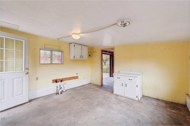 506 E End Road Ext, Bullskin Twp, PA 15425 - kitchen with concrete floors, white cabinetry, and plenty of natural light