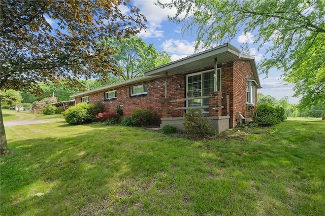 506 E End Road Ext, Bullskin Twp, PA 15425 - view of side of home with brick siding and a lawn