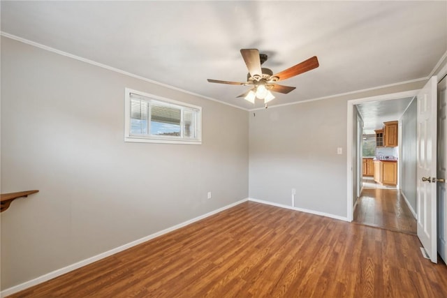 506 E End Road Ext, Bullskin Twp, PA 15425 - unfurnished bedroom with ornamental molding, wood finished floors, multiple windows, baseboards, and ceiling fan