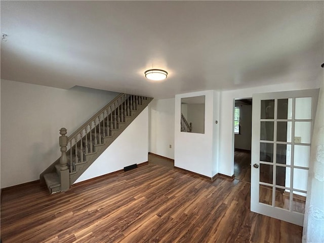 319 Wahl Ave, Evans City Boro, PA 16033 - unfurnished living room featuring stairway, wood finished floors, and baseboards