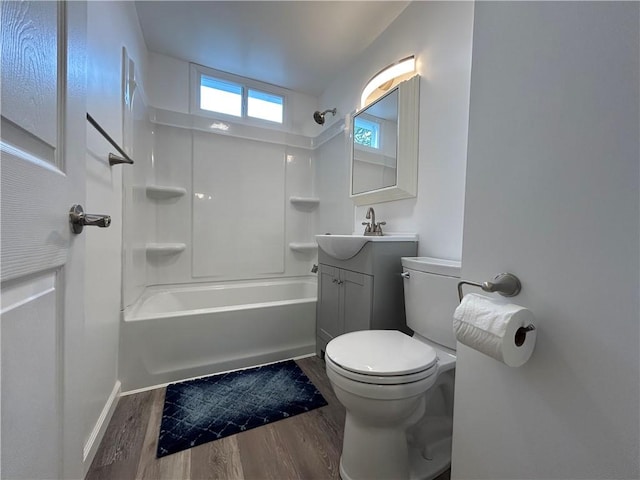 319 Wahl Ave, Evans City Boro, PA 16033 - full bath with wood finished floors, toilet, vanity, shower / tub combination, and baseboards