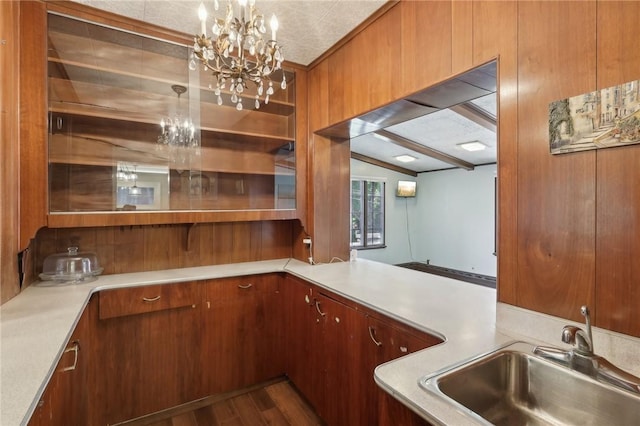 421 E Moody Ave, New Castle/2Nd, PA 16105 - bar featuring a sink, a chandelier, vaulted ceiling, and wood finished floors