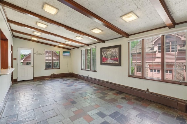 421 E Moody Ave, New Castle/2Nd, PA 16105 - empty room with stone tile floors, beam ceiling, and baseboards