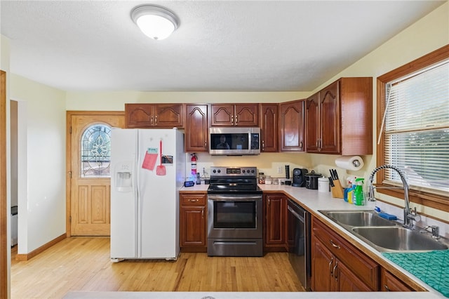 3405 Grandview Rd, Perry Twp Law, PA 16117 - kitchen featuring appliances with stainless steel finishes, a sink, light wood-type flooring, and healthy amount of natural light