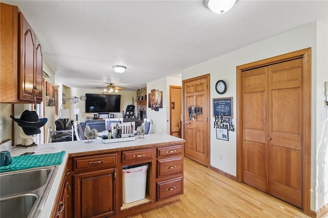 3405 Grandview Rd, Perry Twp Law, PA 16117 - kitchen featuring a peninsula, light wood-style floors, a sink, light countertops, and open floor plan