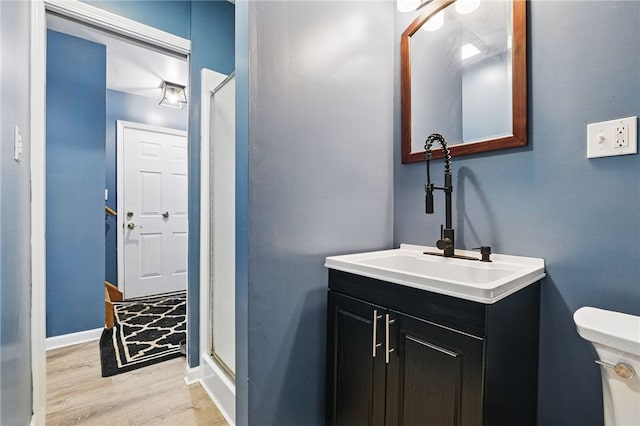 3405 Grandview Rd, Perry Twp Law, PA 16117 - bathroom featuring wood finished floors, vanity, toilet, an enclosed shower, and baseboards