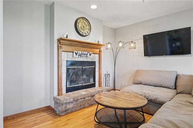 3405 Grandview Rd, Perry Twp Law, PA 16117 - living room with a tiled fireplace, wood finished floors, baseboards, and recessed lighting