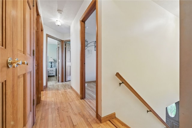 3405 Grandview Rd, Perry Twp Law, PA 16117 - hallway with an upstairs landing, baseboards, and light wood finished floors