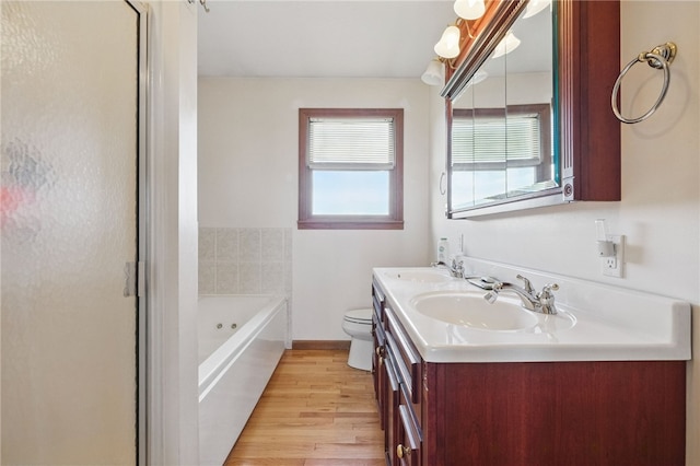 3405 Grandview Rd, Perry Twp Law, PA 16117 - full bathroom featuring a garden tub, double vanity, wood finished floors, toilet, and a shower with door
