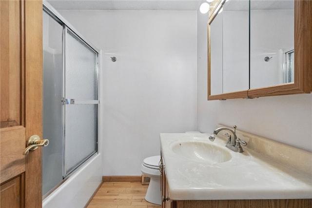 3405 Grandview Rd, Perry Twp Law, PA 16117 - full bath with wood finished floors, toilet, vanity, combined bath / shower with glass door, and baseboards