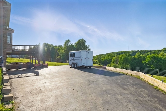 3405 Grandview Rd, Perry Twp Law, PA 16117 - view of patio / terrace featuring a wooded view, a wooden deck, and asphalt driveway