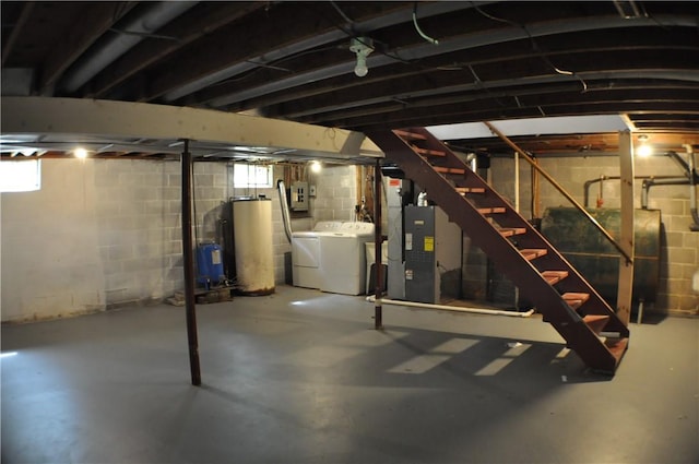 395 Dermond Rd, Hermitage, PA 16148 - below grade area featuring washer and dryer, oil tank, gas water heater, and healthy amount of natural light