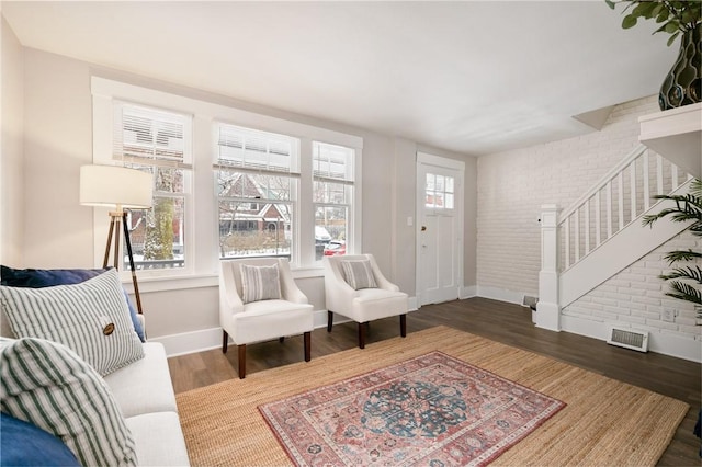 507 Greendale Ave, Edgewood, PA 15218 - entrance foyer featuring brick wall, baseboards, stairs, and wood finished floors