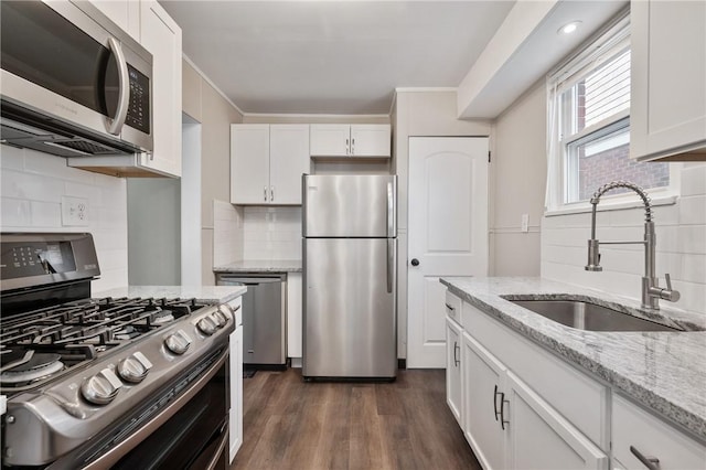 507 Greendale Ave, Edgewood, PA 15218 - kitchen with stainless steel appliances, a sink, tasteful backsplash, white cabinetry, and dark wood finished floors