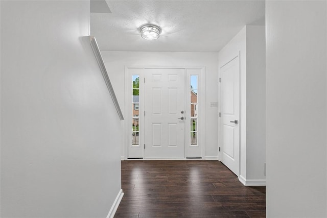 153 Birchwood Way, Irwin, PA 15642 - entryway featuring dark wood-style floors, baseboards, and a textured ceiling