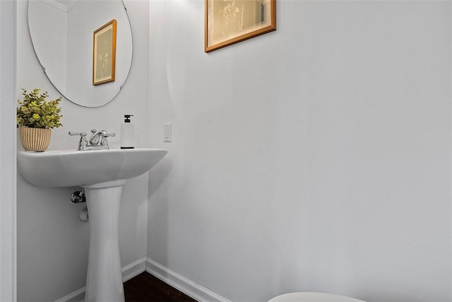 153 Birchwood Way, Irwin, PA 15642 - half bathroom with baseboards, wood finished floors, and toilet