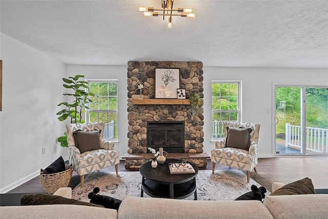 153 Birchwood Way, Irwin, PA 15642 - living room featuring plenty of natural light, wood finished floors, baseboards, and a textured ceiling