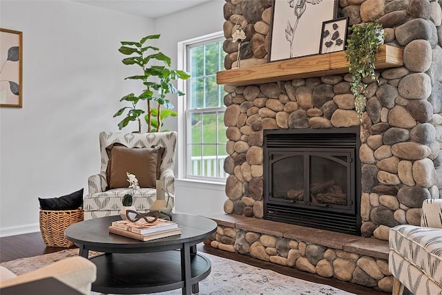 153 Birchwood Way, Irwin, PA 15642 - sitting room featuring a fireplace, wood finished floors, and baseboards