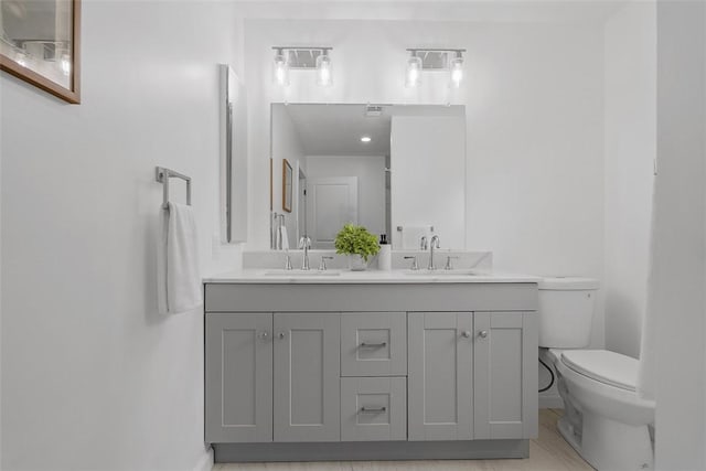 153 Birchwood Way, Irwin, PA 15642 - full bathroom with double vanity, toilet, and baseboards