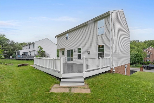 153 Birchwood Way, Irwin, PA 15642 - rear view of house with a lawn and a wooden deck