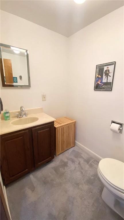 1303 Forest Ave, New Kensington, PA 15068 - bathroom with toilet, vanity, and baseboards