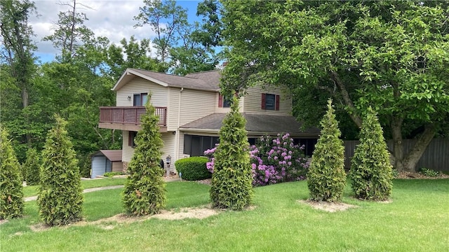 1303 Forest Ave, New Kensington, PA 15068 - view of front facade featuring a balcony, a front lawn, and a shingled roof