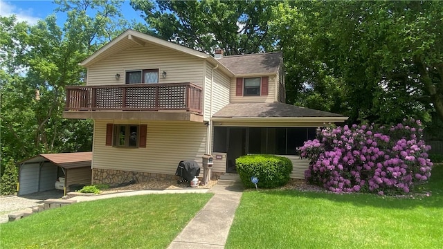 1303 Forest Ave, New Kensington, PA 15068 - view of front of house with a front yard, a balcony, roof with shingles, a carport, and a sunroom
