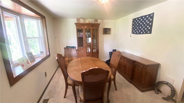 1303 Forest Ave, New Kensington, PA 15068 - dining area featuring light carpet and baseboards