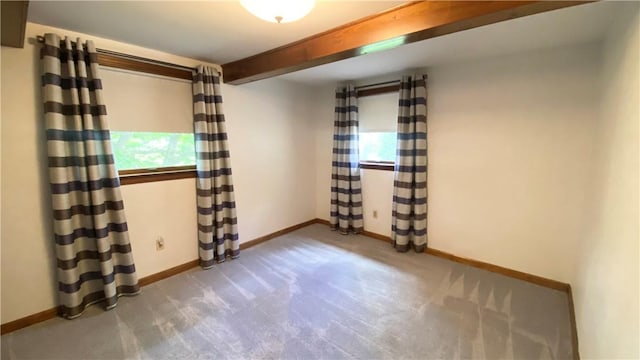 1303 Forest Ave, New Kensington, PA 15068 - carpeted empty room with baseboards, plenty of natural light, and beamed ceiling