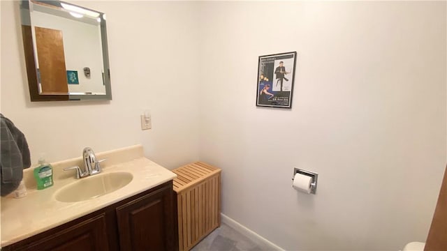 1303 Forest Ave, New Kensington, PA 15068 - half bathroom featuring vanity, toilet, and baseboards
