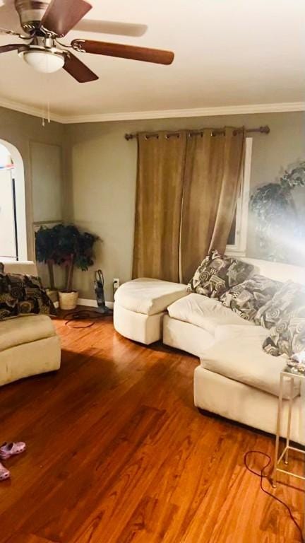 300 Beechwood Ave, Farrell, PA 16121 - living room featuring crown molding, a ceiling fan, wood finished floors, and arched walkways