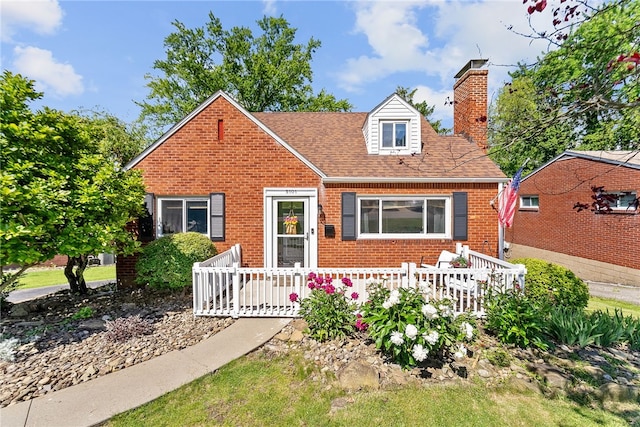 5101 Azalea Dr, Whitehall, PA 15236 - view of front of home with brick siding, a chimney, a deck, and a shingled roof