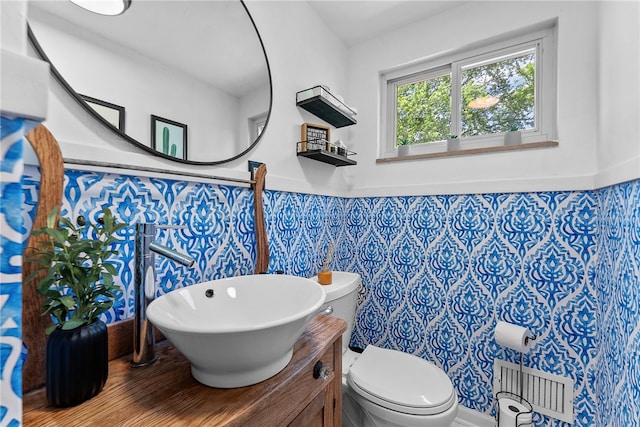 5101 Azalea Dr, Whitehall, PA 15236 - half bath featuring toilet, vanity, wood finished floors, and wainscoting
