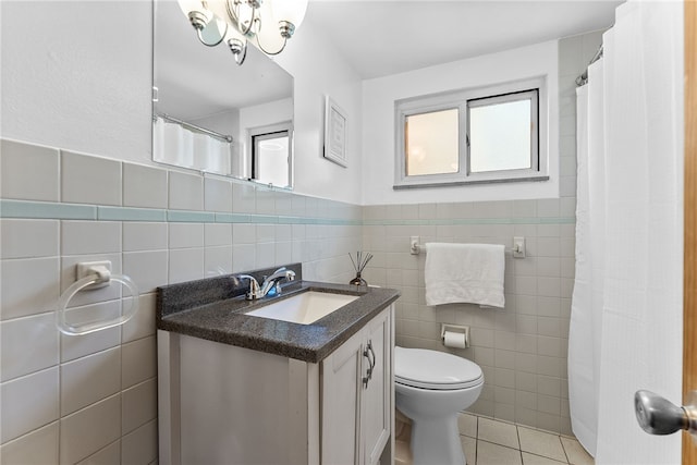 5101 Azalea Dr, Whitehall, PA 15236 - full bath with tile walls, toilet, vanity, tile patterned floors, and a chandelier
