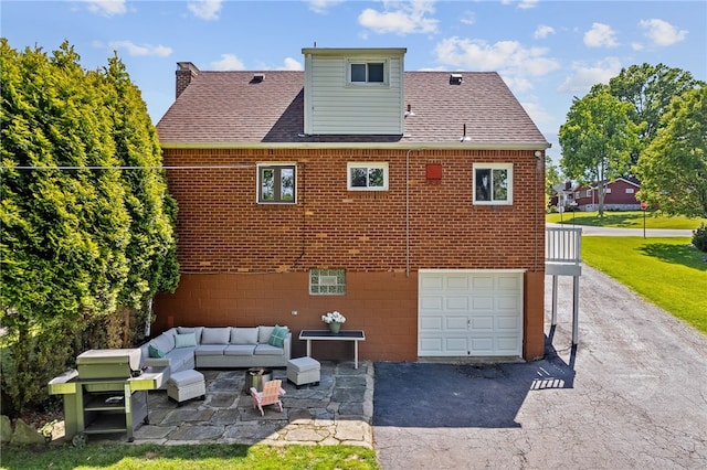 5101 Azalea Dr, Whitehall, PA 15236 - rear view of house featuring a garage, driveway, roof with shingles, and brick siding