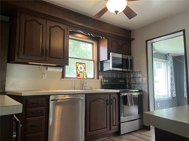 5827 Kings School Rd, Bethel Park, PA 15102 - kitchen with stainless steel appliances, tasteful backsplash, healthy amount of natural light, and dark brown cabinets