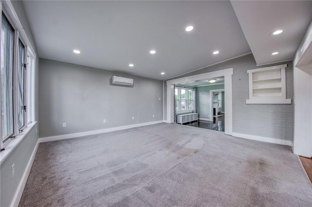1204 Cambridge St, Natrona Hts/Harrison Twp, PA 15065 - unfurnished living room featuring a wall mounted air conditioner, baseboards, carpet floors, and recessed lighting