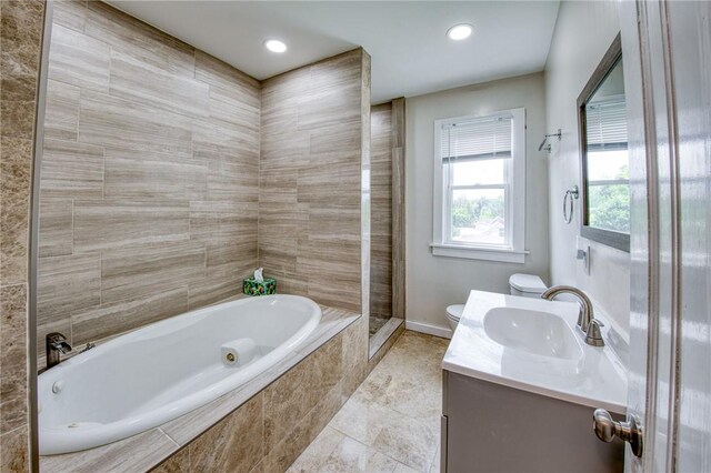 1204 Cambridge St, Natrona Hts/Harrison Twp, PA 15065 - bathroom with a jetted tub, toilet, vanity, a tile shower, and baseboards