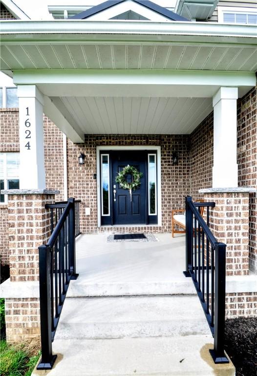 1624 Windsor Rd, North Huntingdon, PA 15642 - entrance to property with covered porch and brick siding