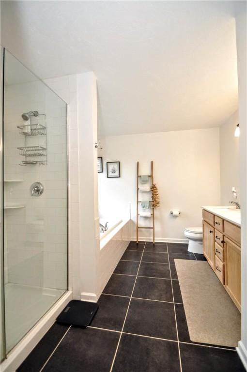 1624 Windsor Rd, North Huntingdon, PA 15642 - full bathroom with a garden tub, a tile shower, vanity, tile patterned flooring, and toilet